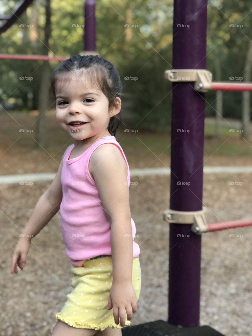 My beautiful daughter playing on the neighborhood playground. Just a smiling and enjoying every minute of it. 