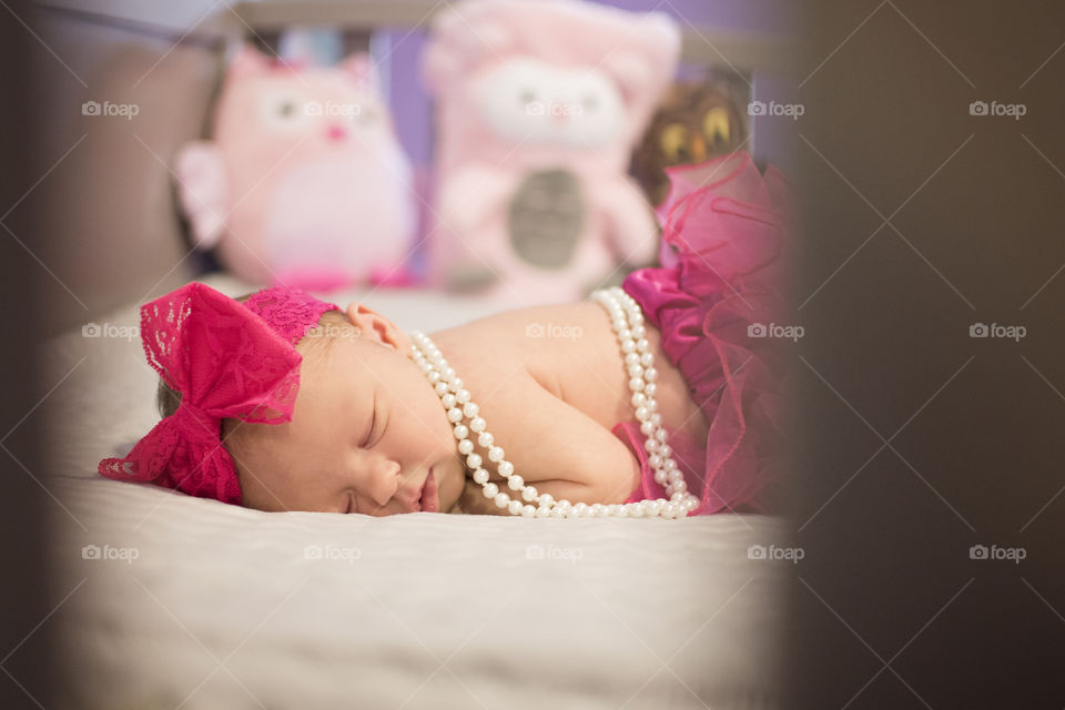 Cute little baby sleeping on bed