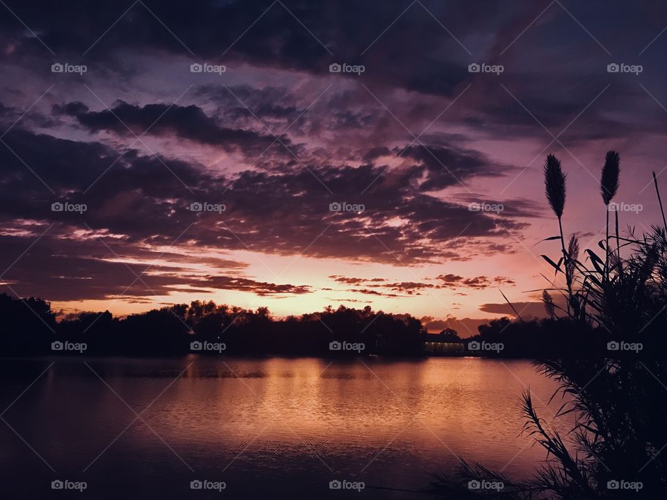 Last light is approaching quickly Night will consume the sky, Lake clouds will Darken for Night. 