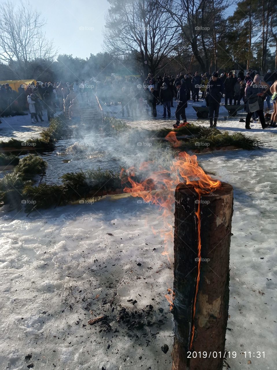 Epiphany. People swim in the ice-hole for Epiphany. Fire.