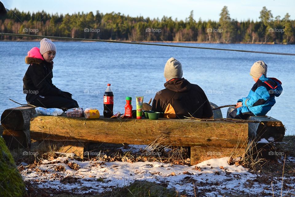 A family having picnic at the open fire