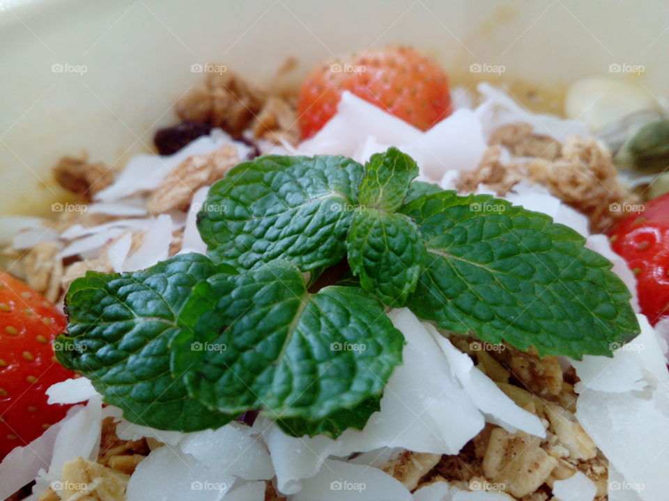 Fruit Smoothie bowl with fresh mint leaves
