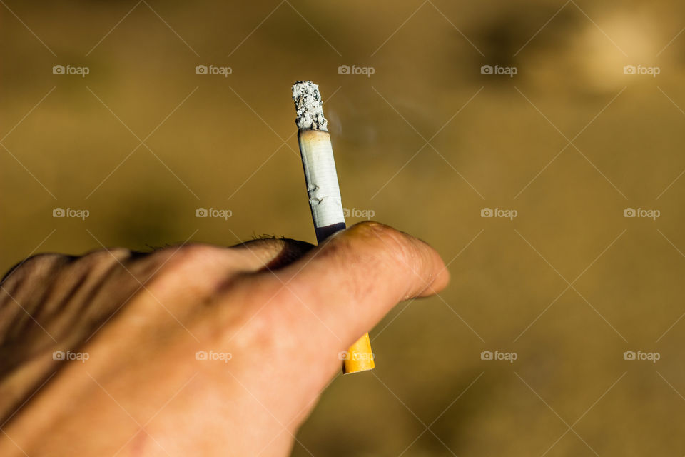 smoking a cigarette outside