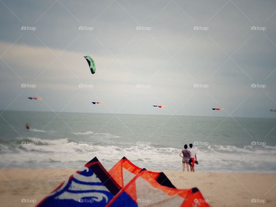 Kite surfing . Kite surfer on the windy beach of Mui Ne, Vietnam