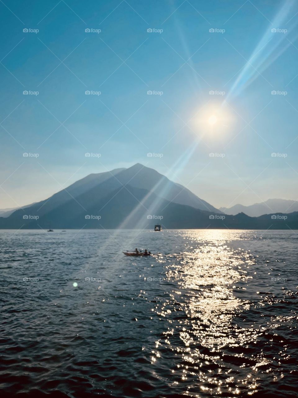 Sun glistens on tranquil lake