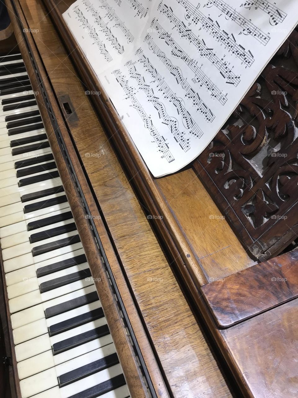 a piano with sheet music to play