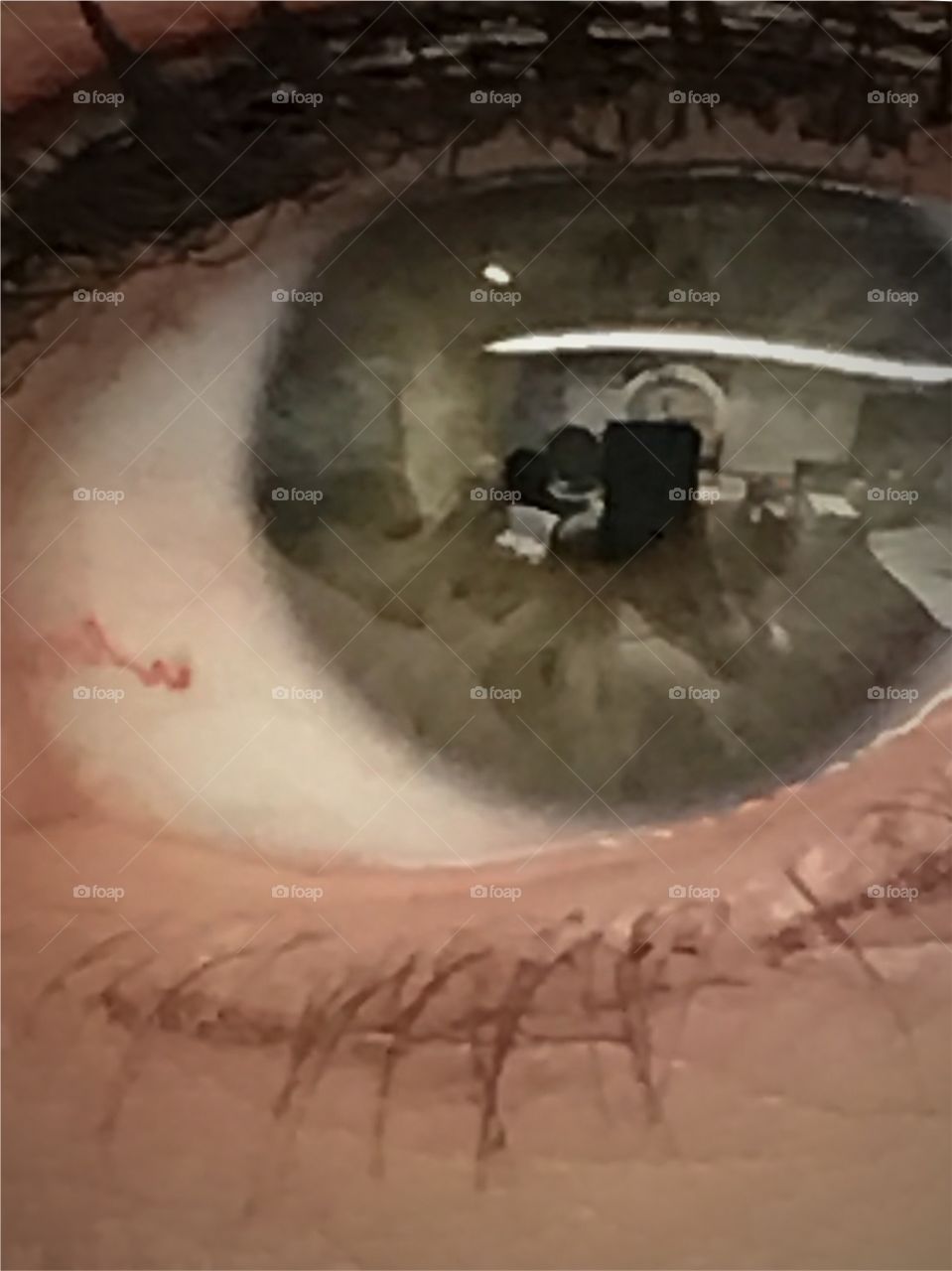 Hazel green eye reflection