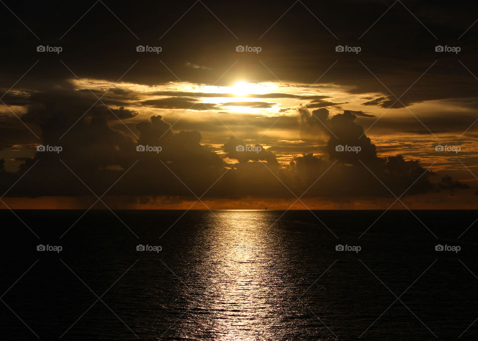 Dramatic Partially Cloudy Sunrise over the Atlantic Ocean