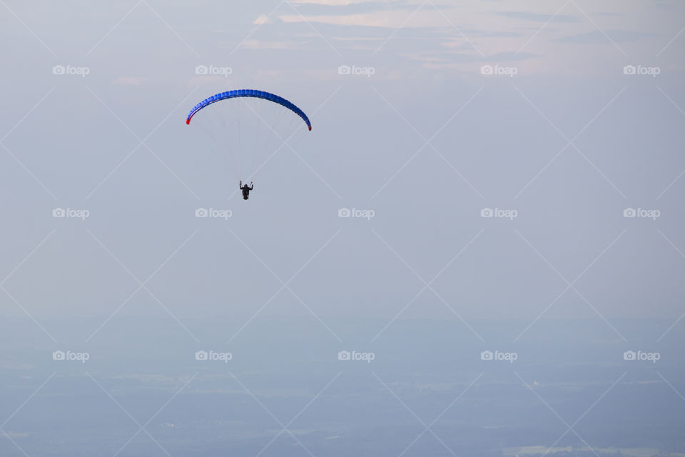 Paragliding high in the sky 