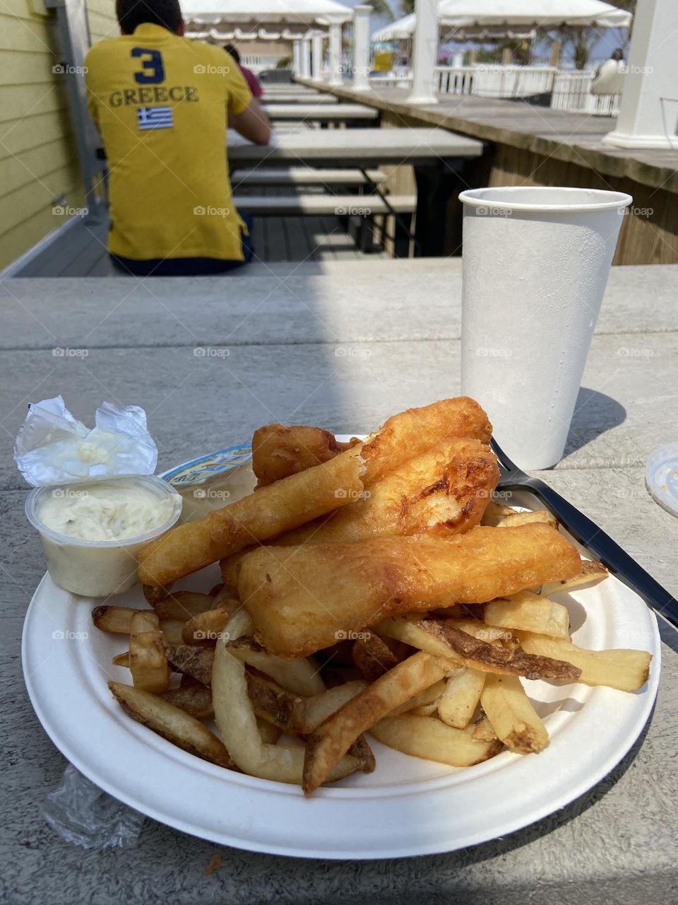 Fish and chips at the boardwalk is an essential part of summer. It seems a lot of my summer revolves around food! This is pictured at a table behind a food stand at the boardwalk. There is a view of the beach, but I was focused on the food. 
