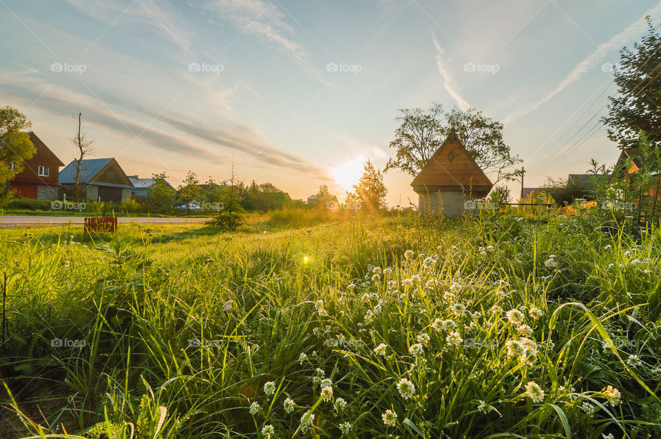 Beautiful rural landscape in Russian village, in sunrise