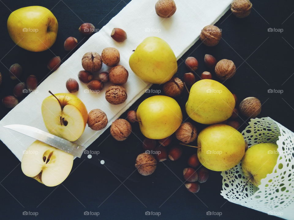 Apples and nuts. Apples and nuts on dark background