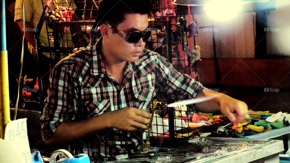 Making glasses art at chiang Mai, northern Thailand