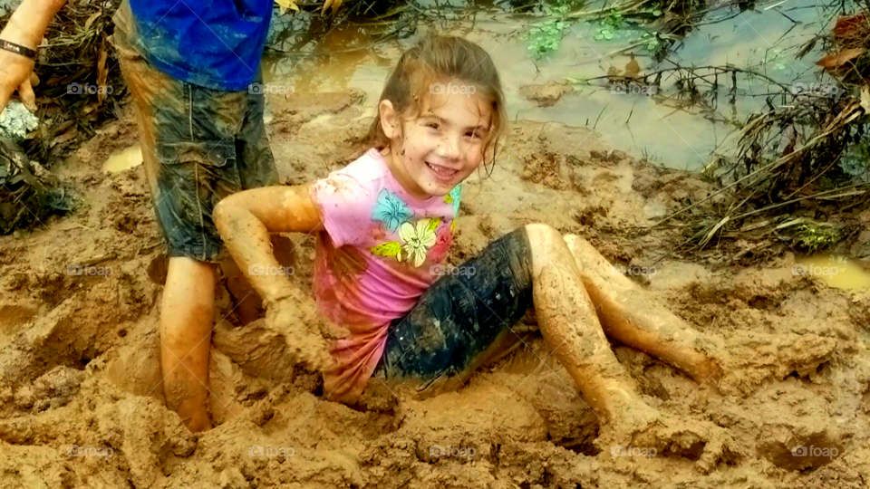my daughter sitting in the mud having fun Vidor Texas United States of America 2018