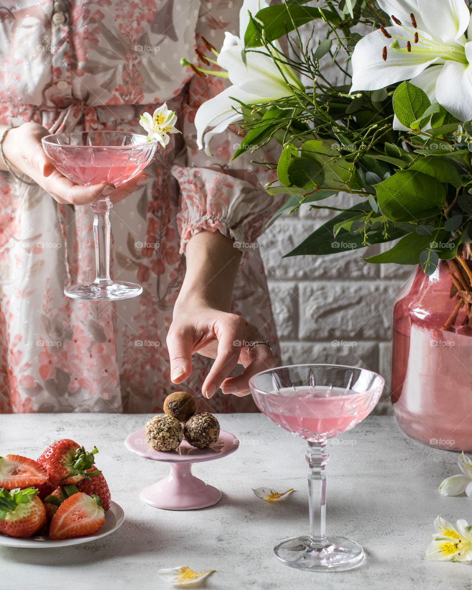 Pink cocktail and truffles 