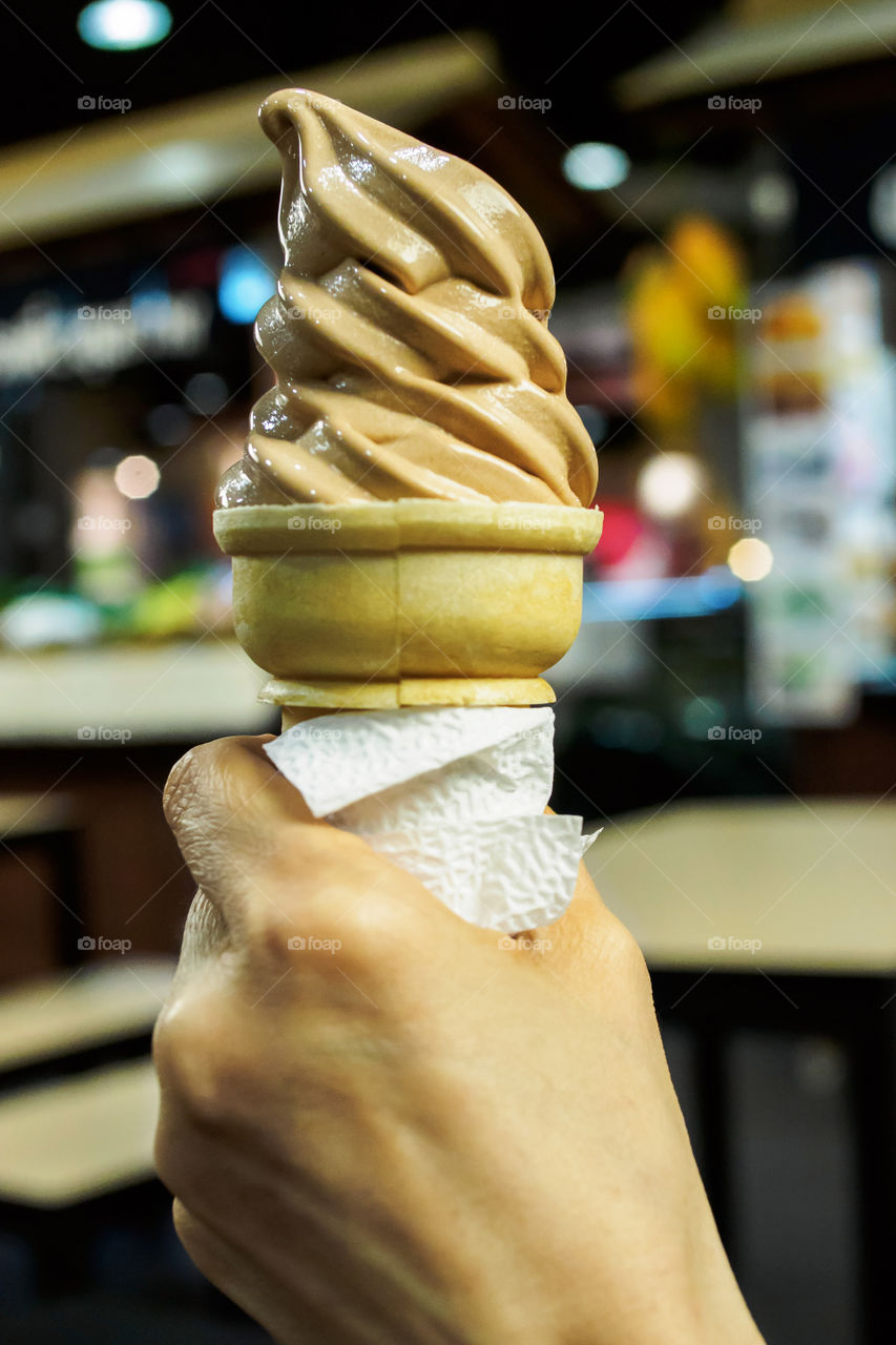 Hand holding ice cream 