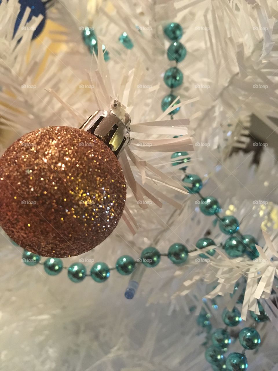 A little golden ornament hanging on my Christmas tree.