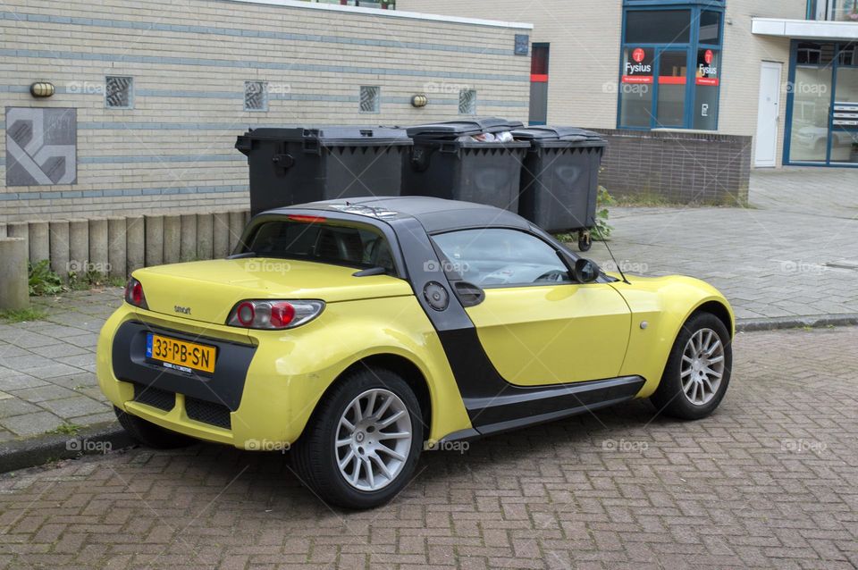 A Yellow Smart Car At Amsterdam The Netherlands 12-6-2024