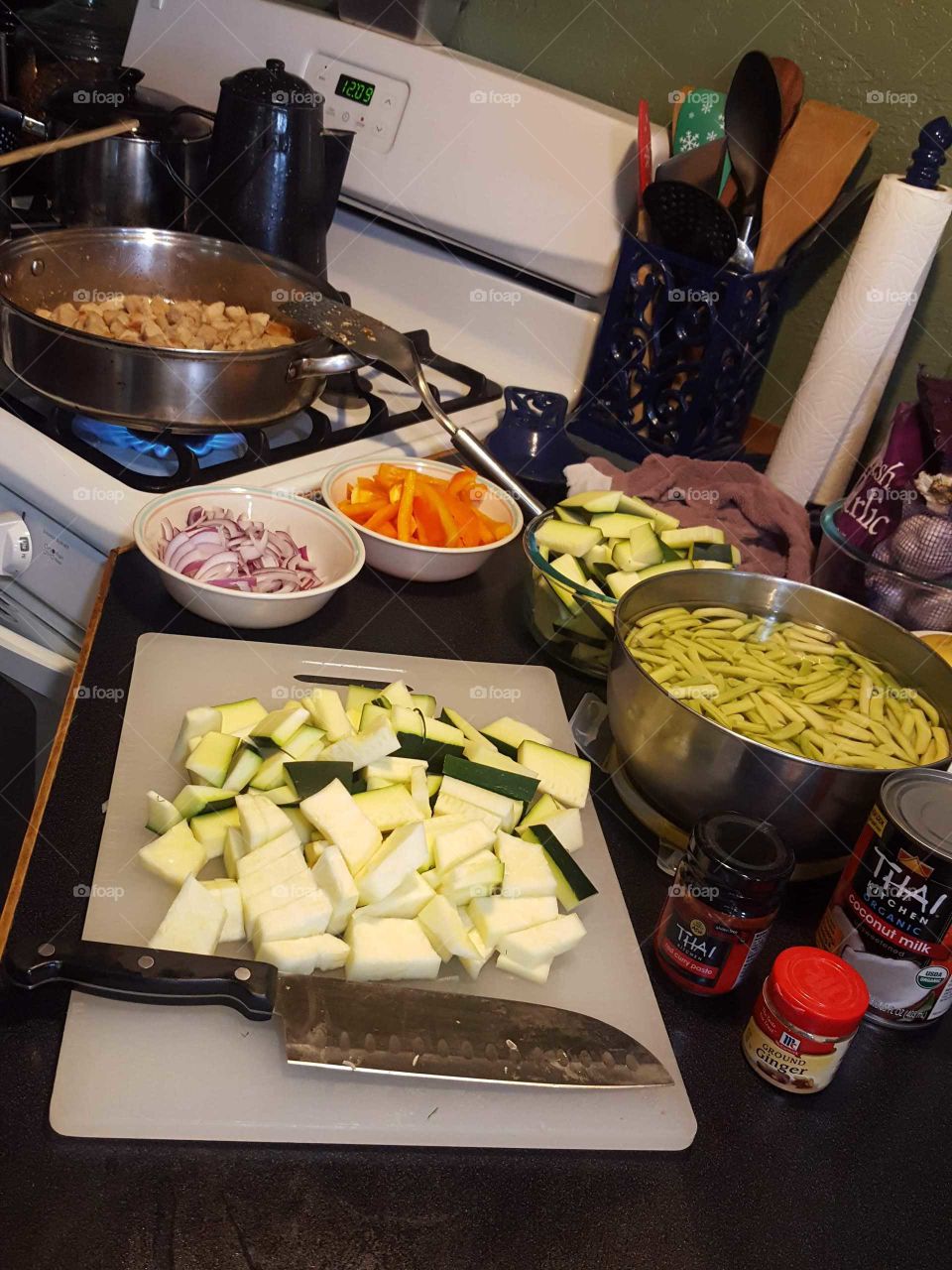 cooking, chopping, veggies,  thai coconut, smells delicious, cooking for the family