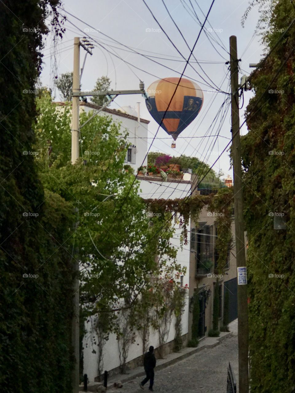 A Balloon flying over San Miguel de Allende seen from the door where I was staying