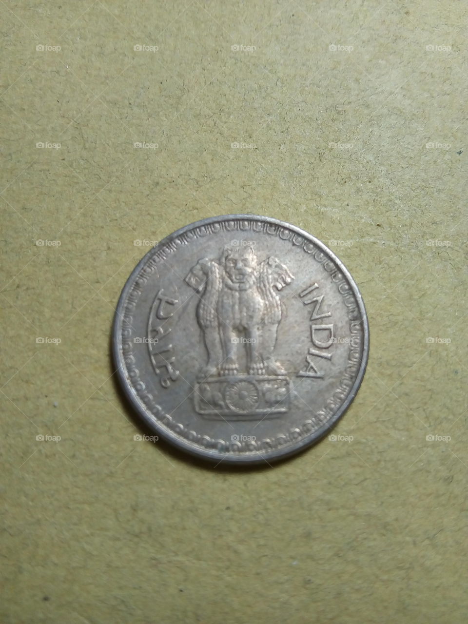 A coin of Twenty five paise- 1/4 share of Indian Rupee issued by Government of India in 1988.