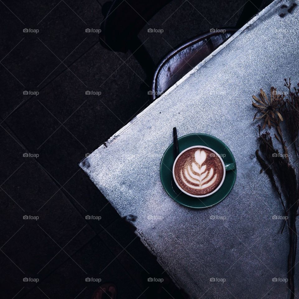 High angle view of coffee cup on table