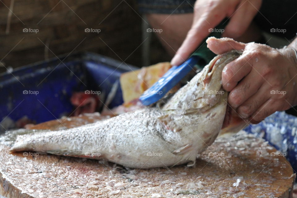 fish preparing at fresh market.