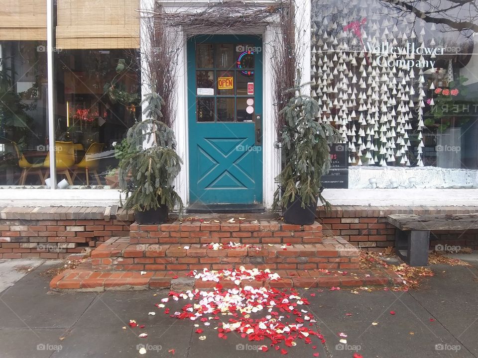 storefront with flower petals