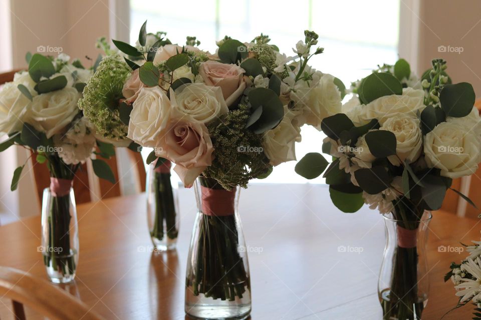 What is better than Flowers in a vase - four wedding bouquets in four vases white and pink roses