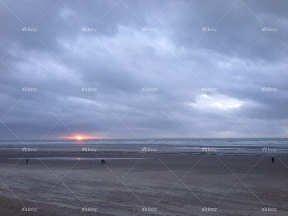 December sunset at the beach in Le Touquet, France.