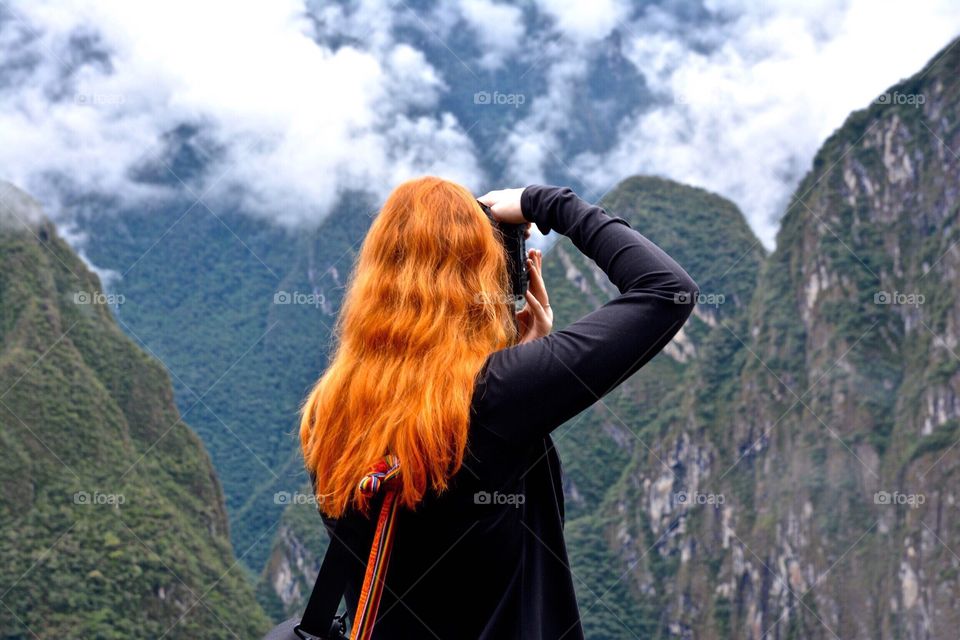 Red haired photographer in the Andes