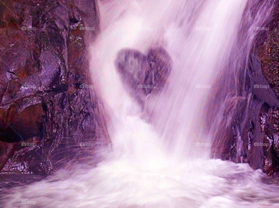 Heart symbol on a waterfall