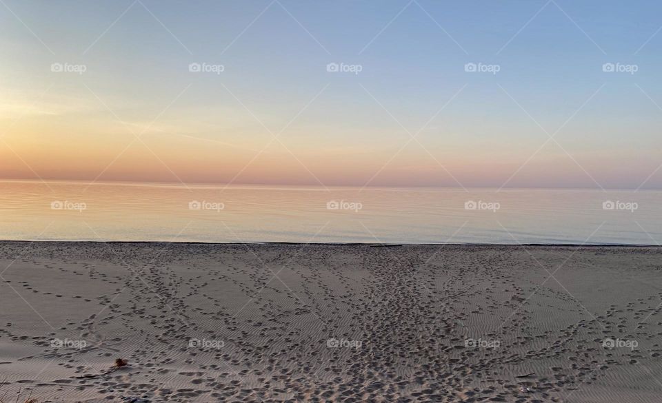 Sunset on a sandy beach on Lake Superior in the Upper peninsula  of Michigan