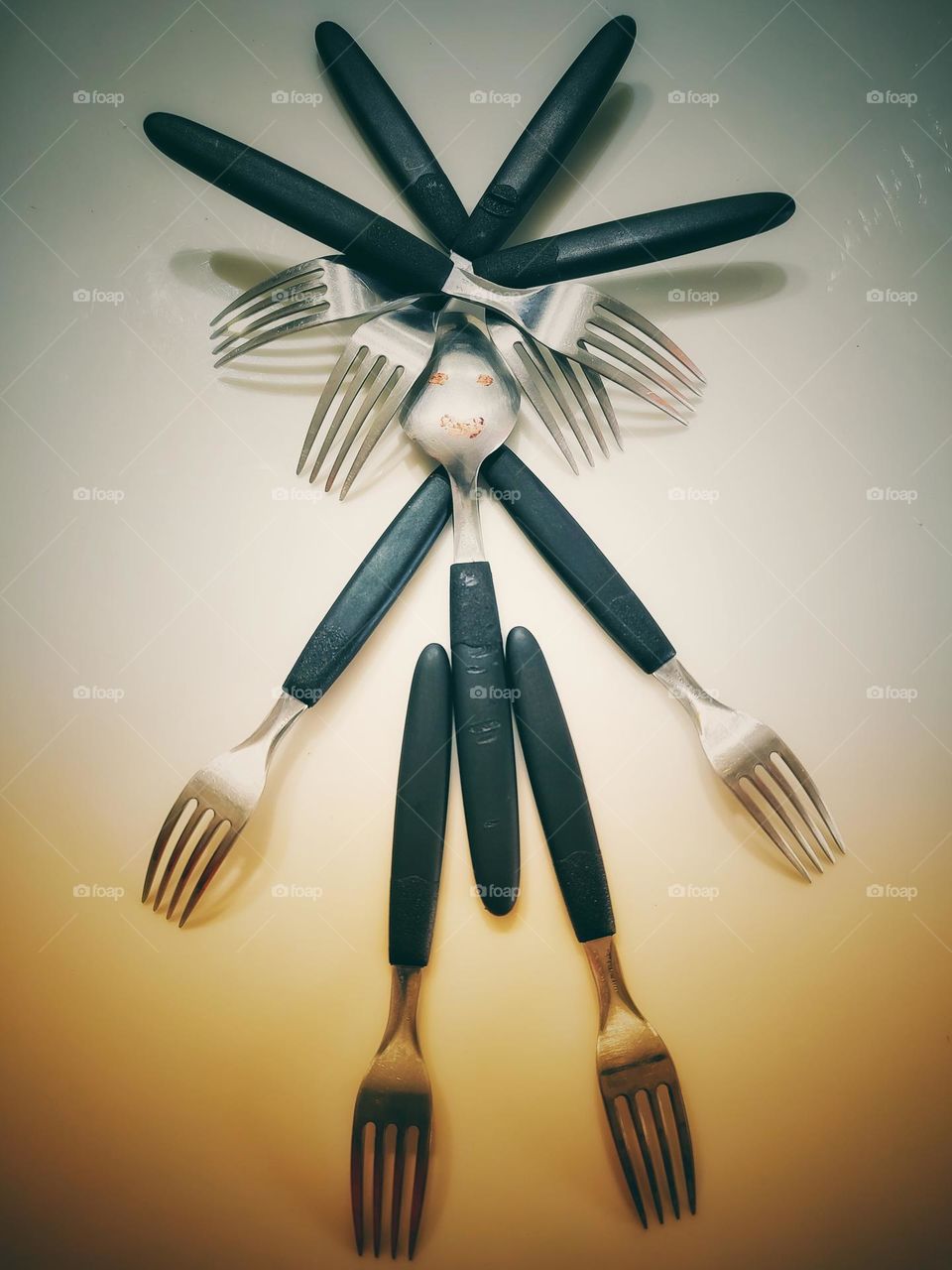 a fun doll made of forks.