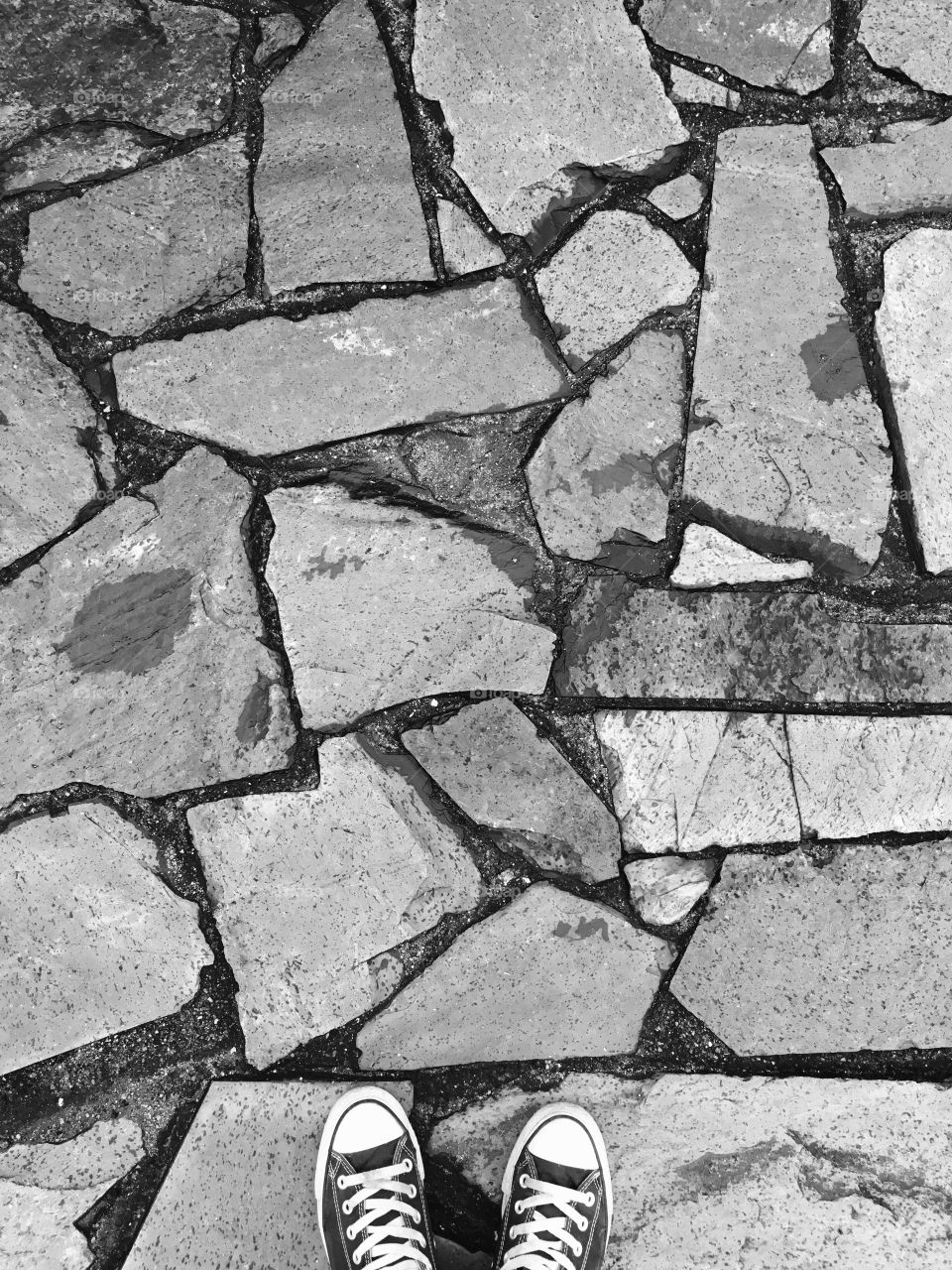 Canvas Shoes on Stone Pavement