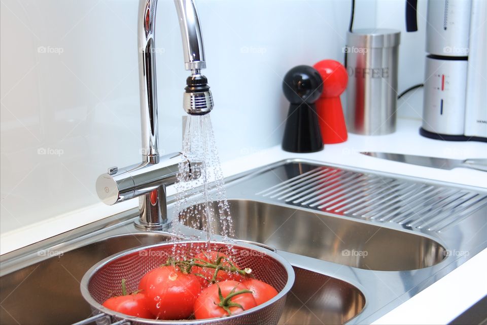 rinsing tomatoes 
