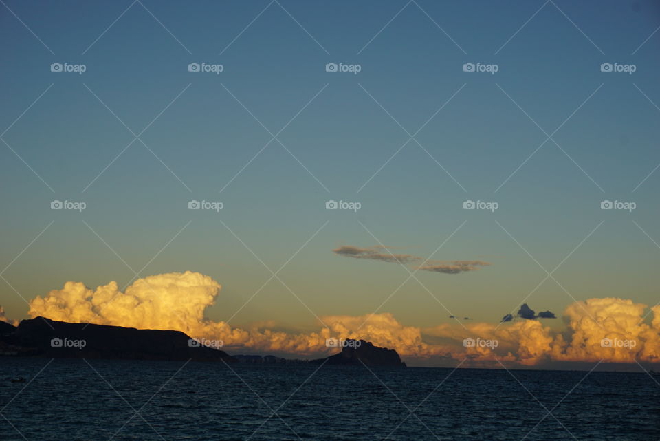 Sunset#beach#clouds#stones#mountain#moment