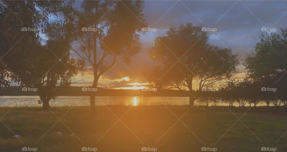 The reflection of the sunset over the lake. The trees framed the shot perfectly.  