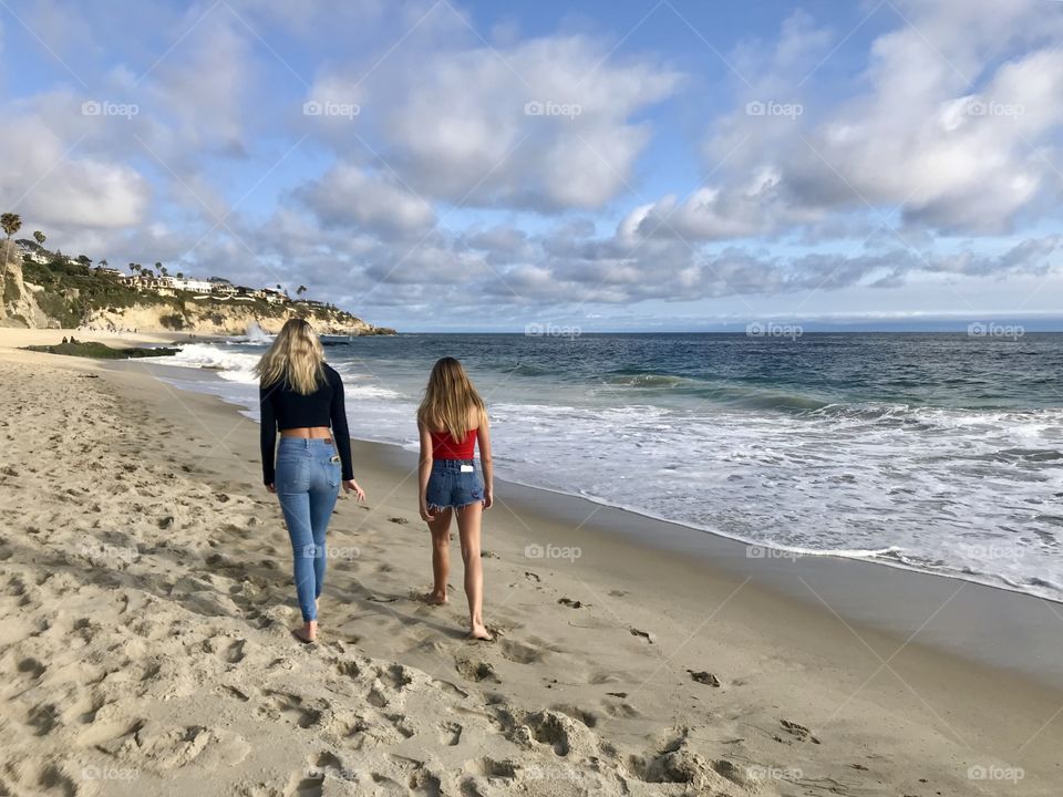 Girls walking on the beach in Laguna Beach CA