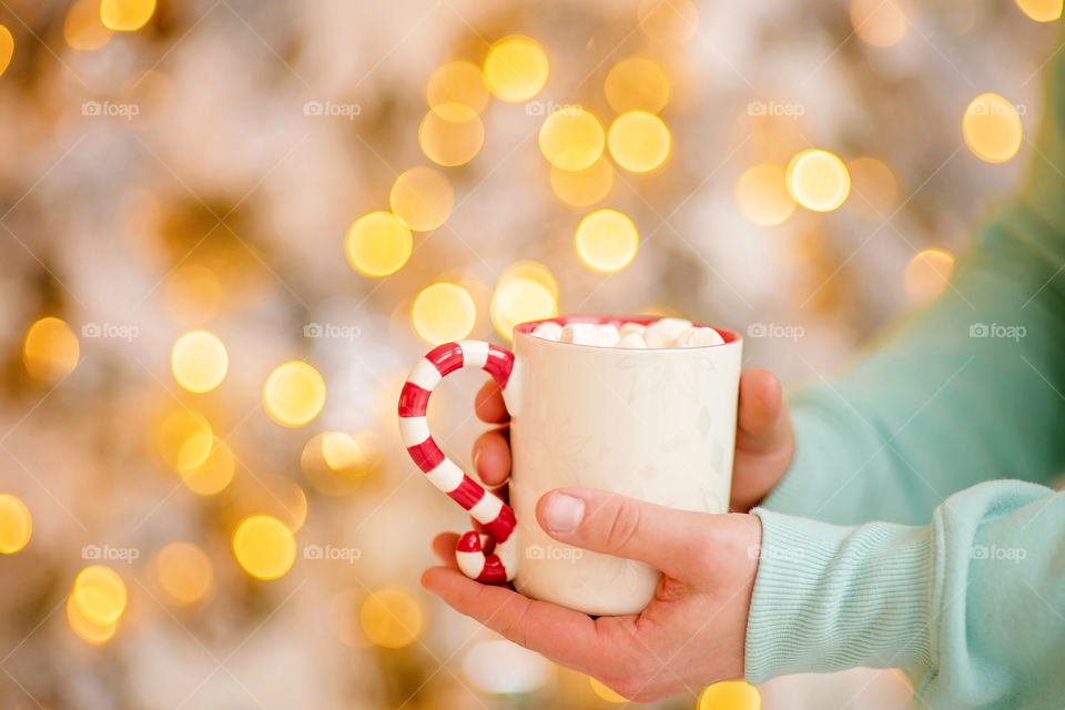 cup of coffee in a cozy festive Christmas atmosphere