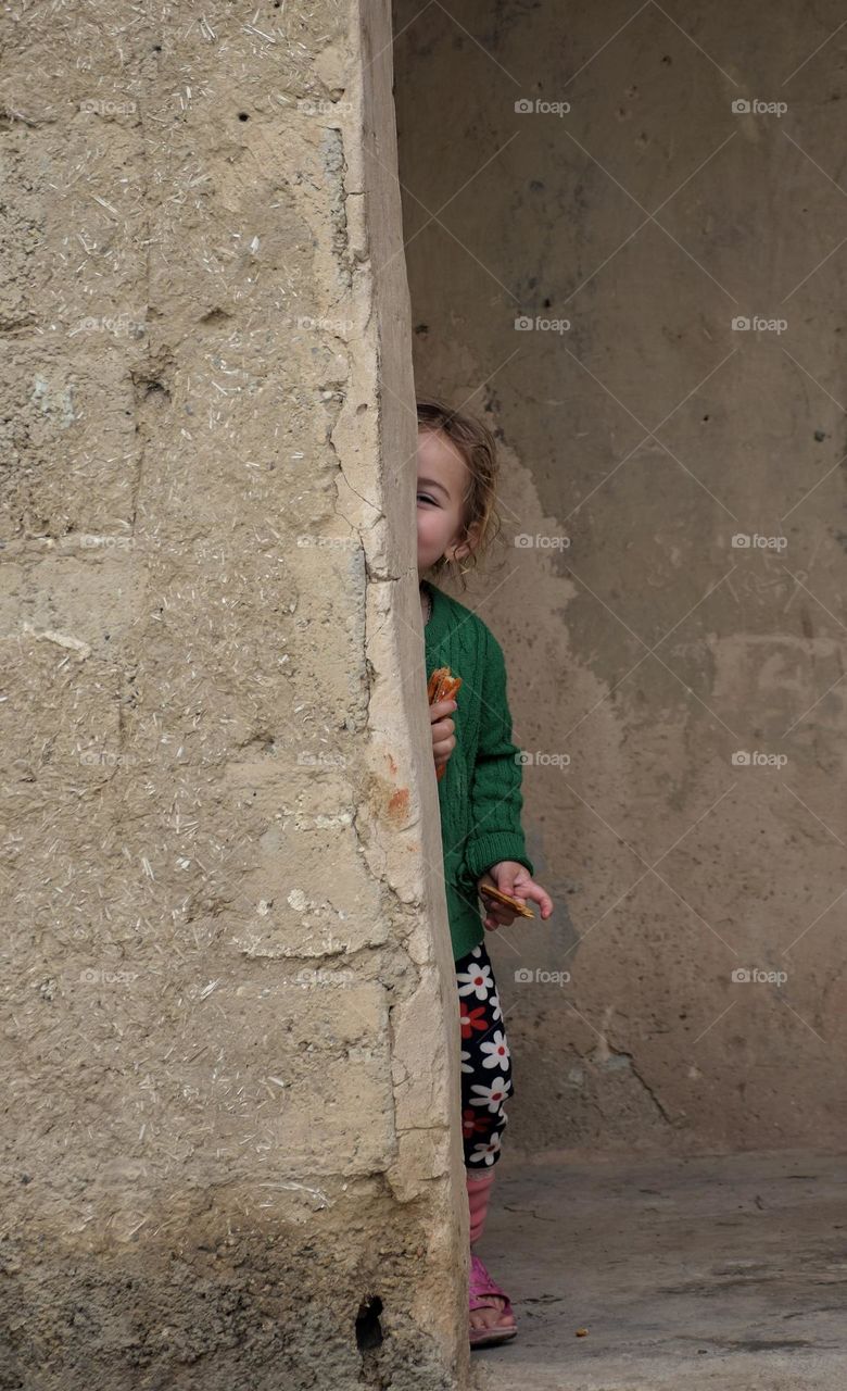Shy girl with slices of bread