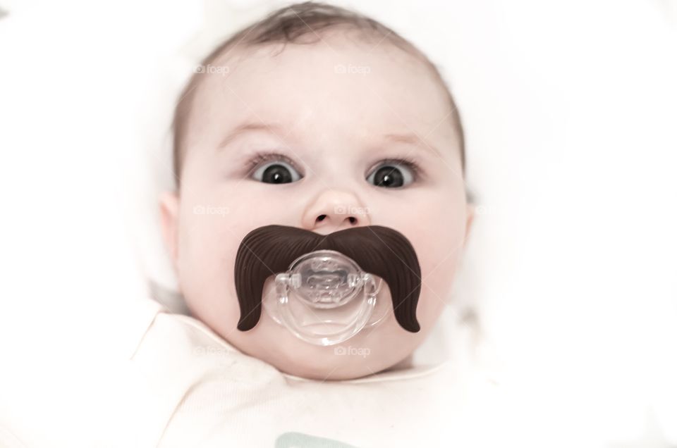 Cute baby with pacifier