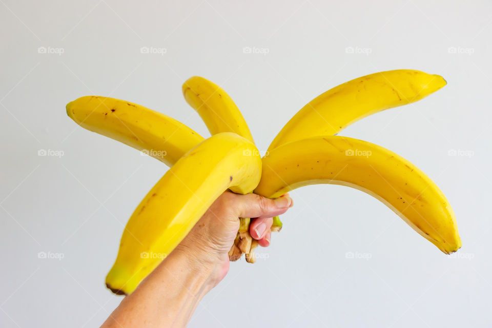 Five bananas in hand