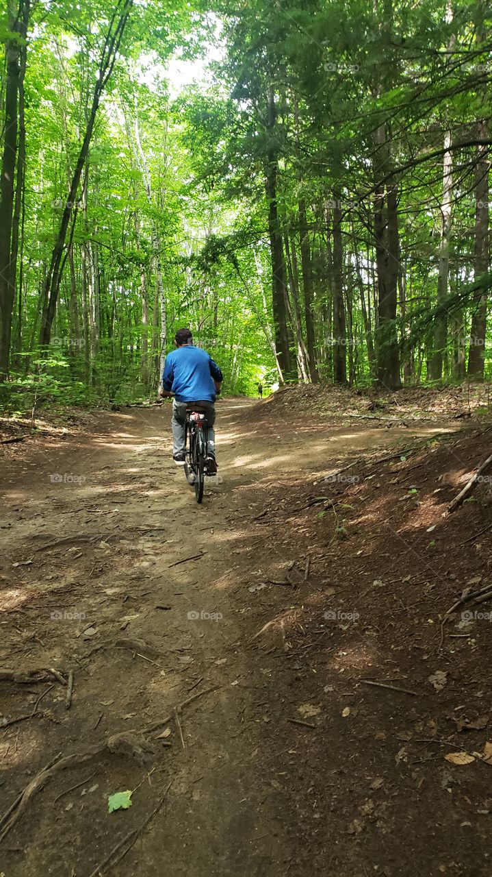 Riding a bicycle in the forest