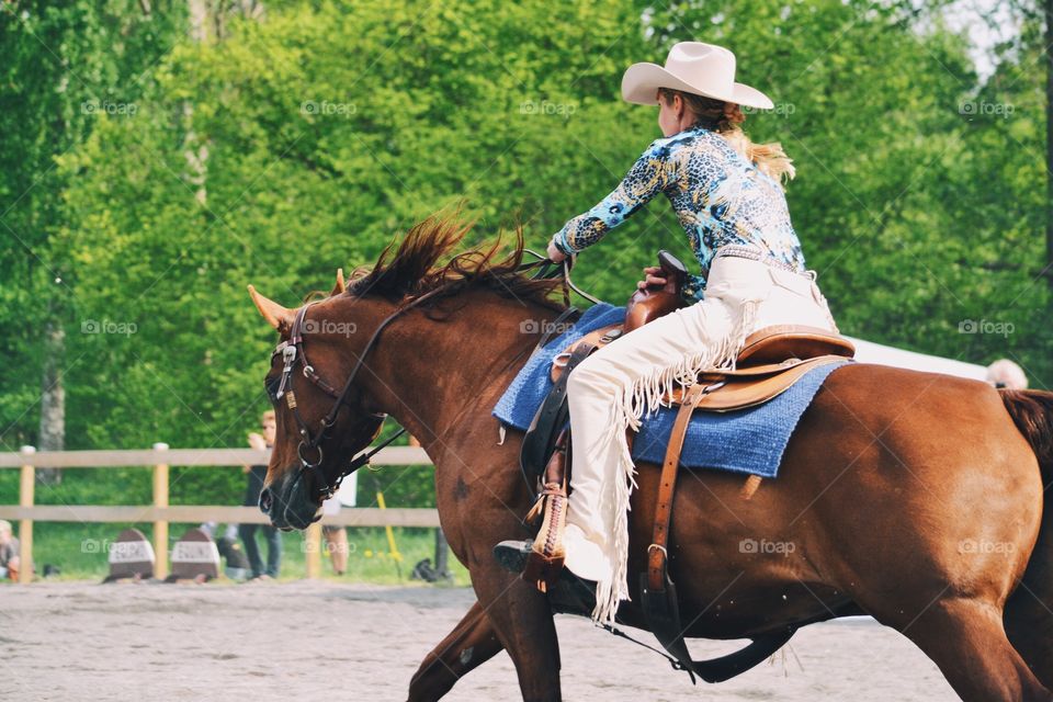 Woman riding a western horse