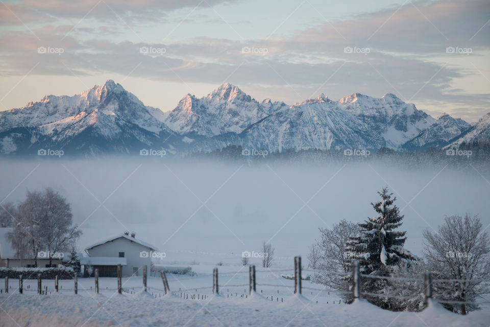 A foggy town in the Alps