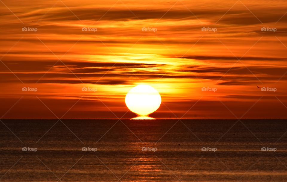 Bright sunrise over the baltic in gdynia, poland