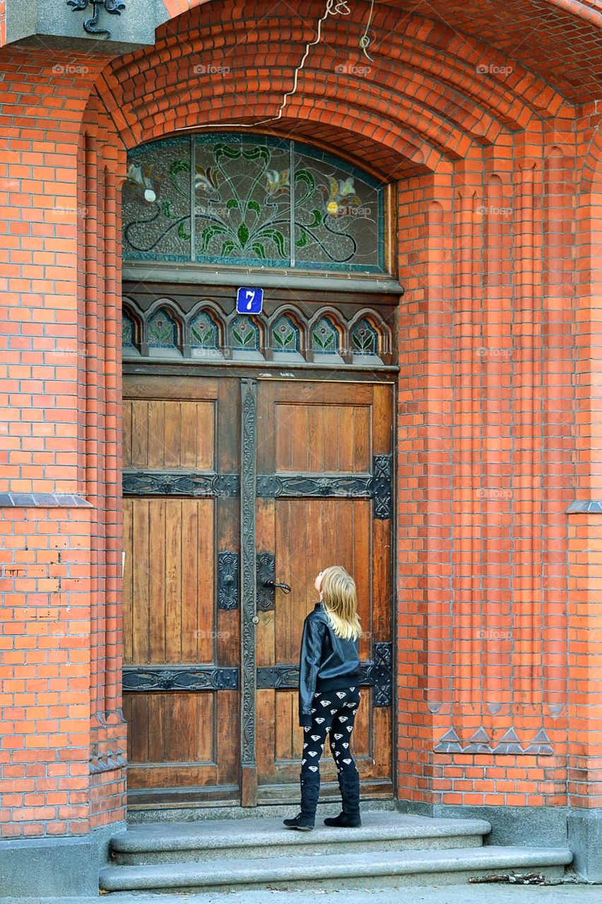 Girl at the entrance of a building