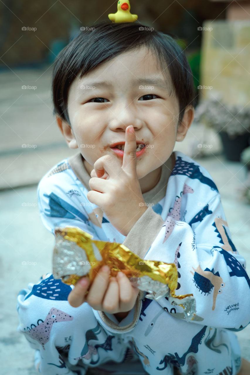 He played with his duck stuffed with laughter