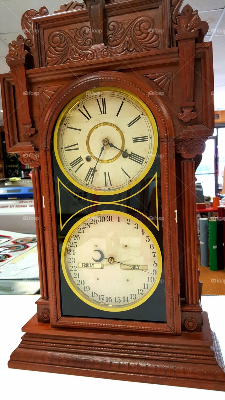 clock. repainted the glass on this very old clock